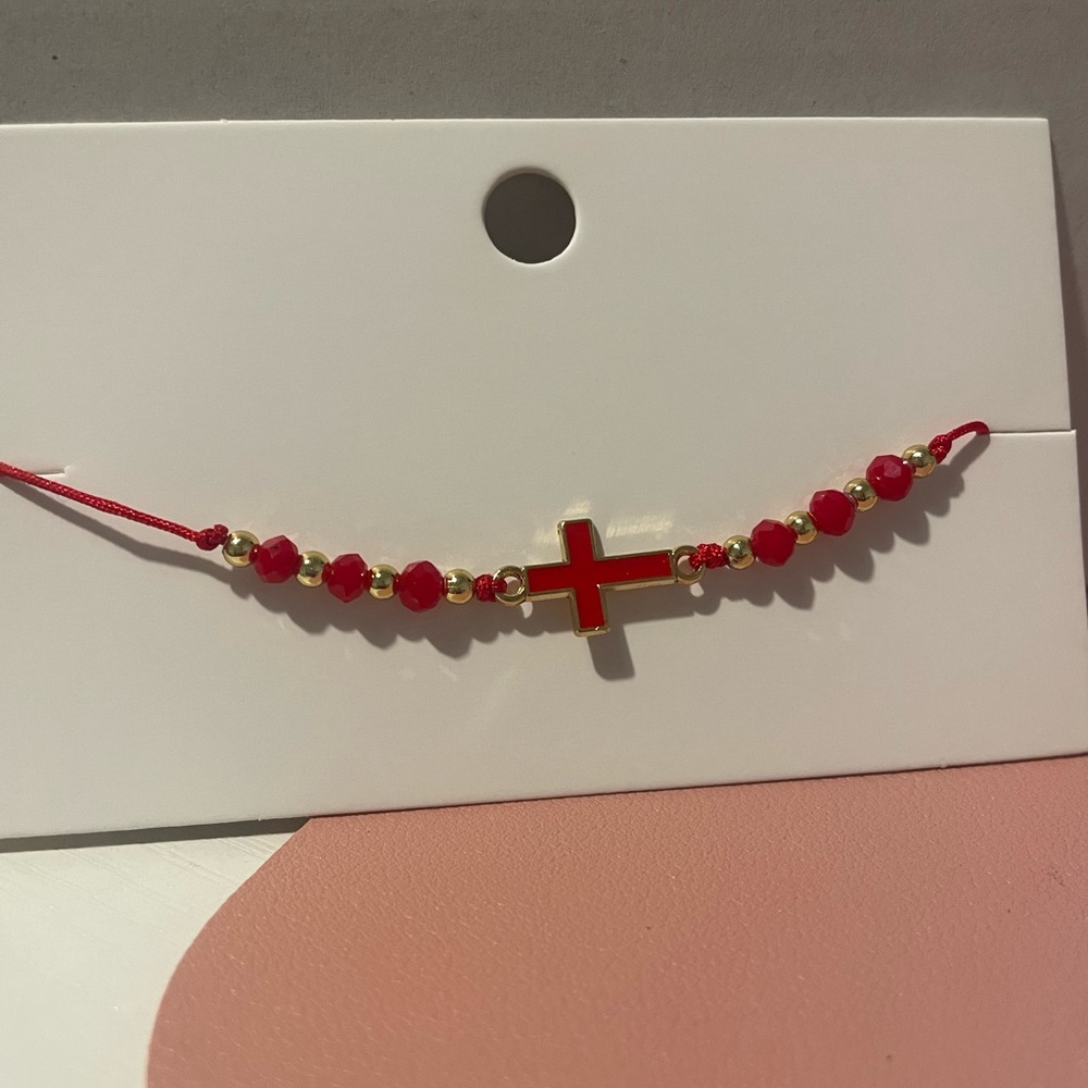 Cross Tie Bracelet in the color Ruby Red